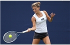 EASTBOURNE, ENGLAND - JUNE 14: Jade Windley of Great Britain plays a forehand against Ajla Tomljanovic of Croatia during their Women's Singles first round qualifying match on day one of the Aegon International at Devonshire Park on June 14, 2014 in Eastbourne, England.  (Photo by Steve Bardens/Getty Images)